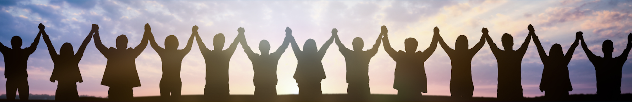 silhouette of people holding hands in a long chain